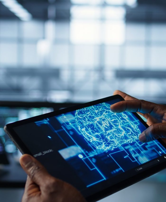 Programmer in data center using AI tech on tablet, testing equipment failover scenarios. Server farm IT specialist uses artificial intelligence on device, ensuring data accessibility, camera B closeup